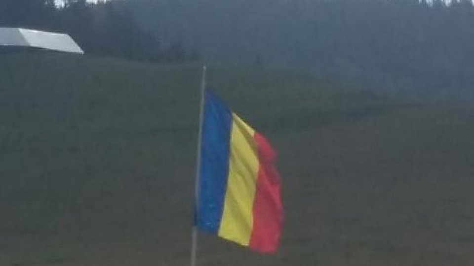 Romania’s flag flying on the country’s highest peak