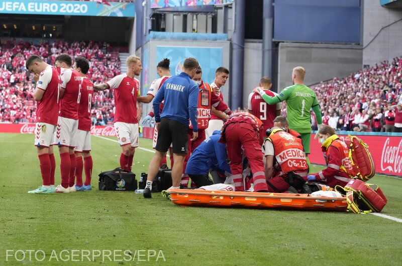  Christian Eriksen of Denmark (bottom) receives medical assistance during the UEFA EURO 2020 group B preliminary round soccer match between Denmark and Finland in Copenhagen, Denmark, 12 June 2021. EPA/Martin Meissner